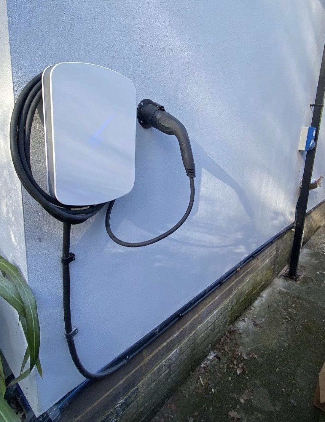 EV charge point mounted on an exterior wall